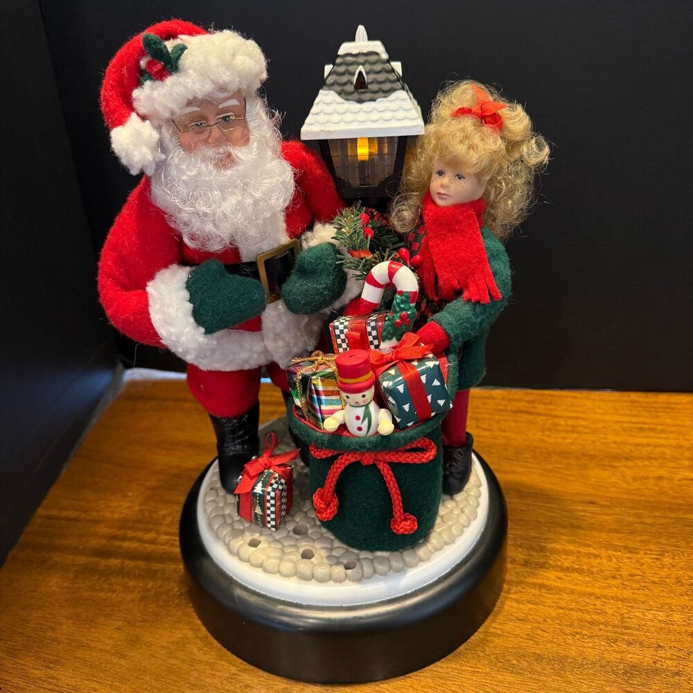 Gemini said Vtg 1996 Holiday Creations Animated Musical Santa & Girl Lamp Post